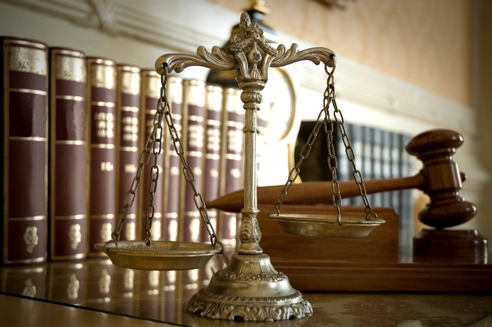 A close up of the scales of justice on top of a table.